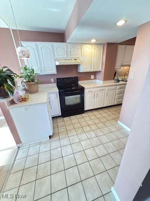 kitchen featuring decorative light fixtures, light countertops, black electric range oven, white cabinetry, and under cabinet range hood