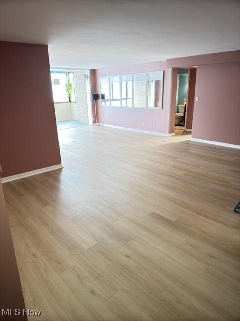 spare room featuring light hardwood / wood-style flooring