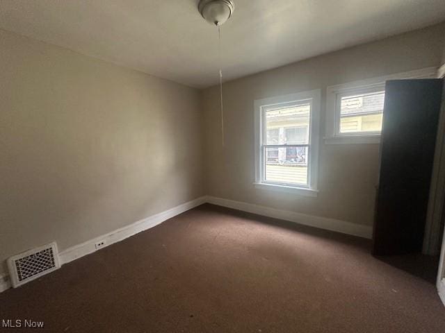 spare room with carpet floors