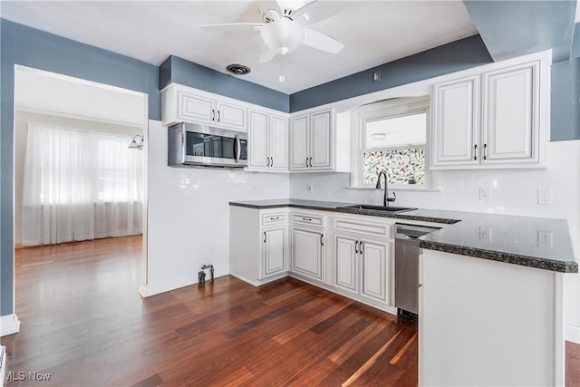 kitchen with sink, white cabinetry, and appliances with stainless steel finishes