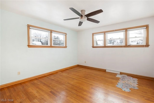 spare room with ceiling fan and hardwood / wood-style floors