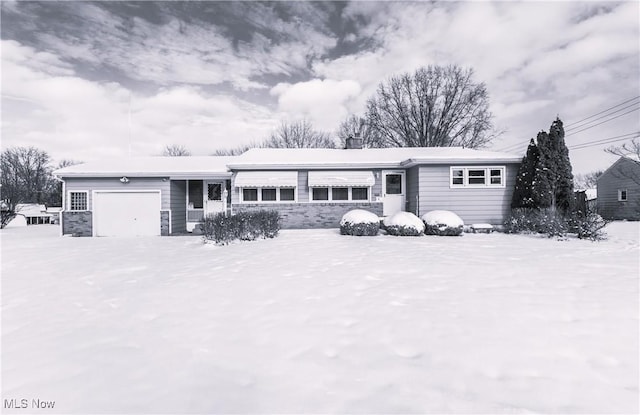 single story home featuring a garage