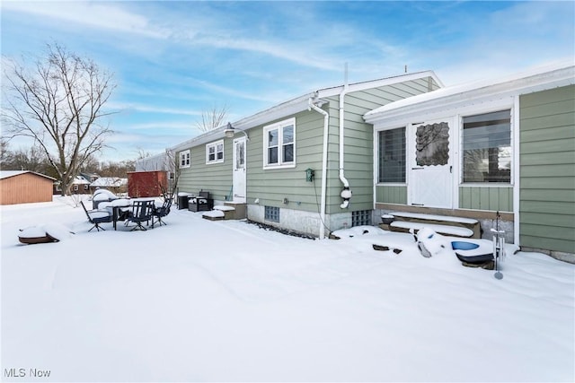 view of snow covered house