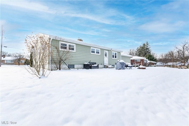 view of snow covered house