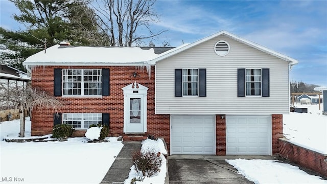 bi-level home featuring a garage