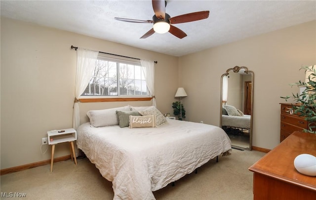 bedroom featuring ceiling fan and light carpet