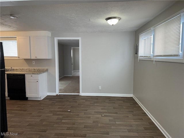 kitchen with a textured ceiling, white cabinetry, dishwasher, and dark hardwood / wood-style floors