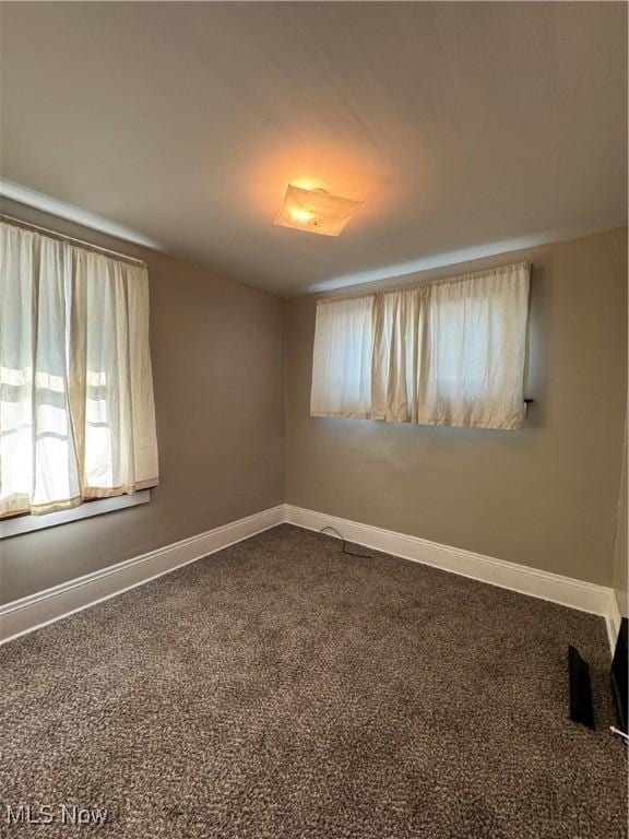 spare room featuring carpet flooring