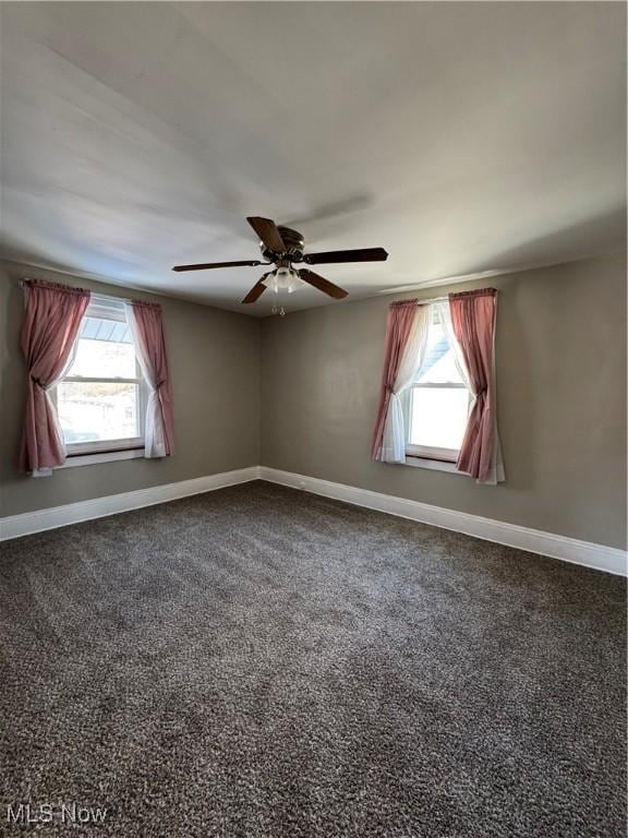 carpeted empty room featuring ceiling fan