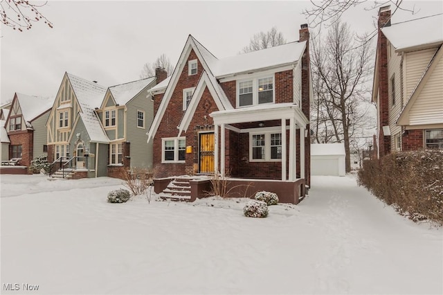 tudor house featuring an outdoor structure