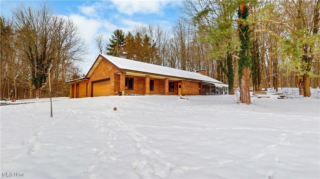 view of snow covered garage