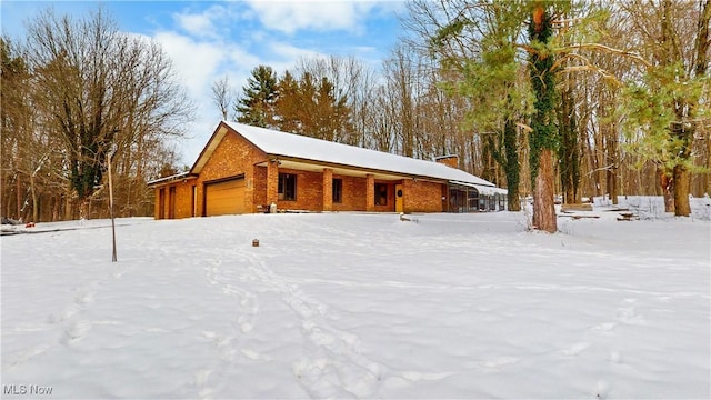 view of snow covered garage