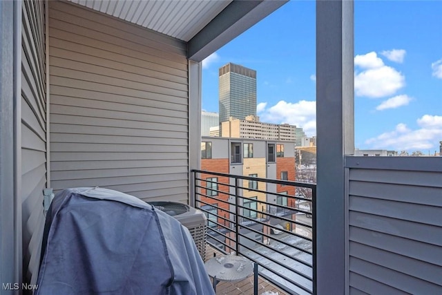 balcony with a grill and central AC unit