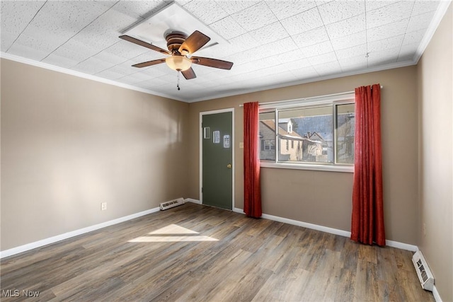 unfurnished room with ceiling fan, wood-type flooring, and ornamental molding