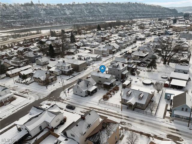 snowy aerial view featuring a mountain view