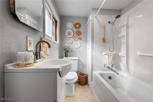 full bathroom featuring a textured ceiling, toilet, shower / washtub combination, and vanity