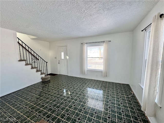 foyer featuring a textured ceiling