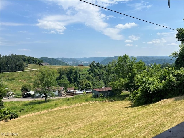 view of mountain feature with a rural view