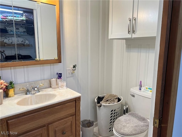 bathroom with toilet and vanity