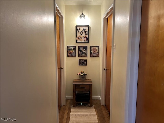 hallway with light hardwood / wood-style flooring