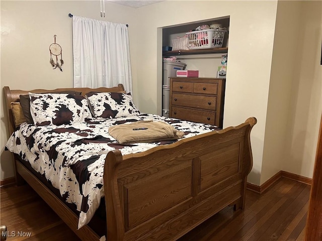 bedroom featuring dark wood-type flooring