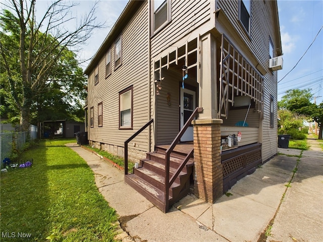 view of property exterior with a yard