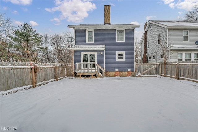 view of snow covered house