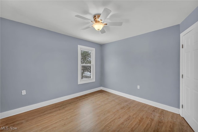 unfurnished room with ceiling fan and light hardwood / wood-style flooring