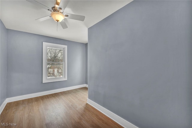 empty room featuring ceiling fan and light wood-type flooring