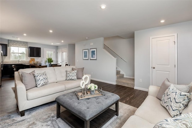 living room featuring dark wood-type flooring