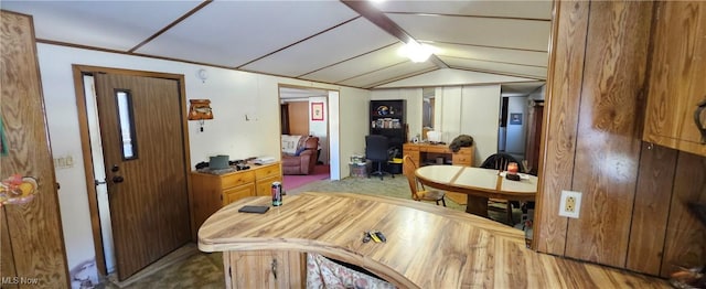 dining space featuring vaulted ceiling