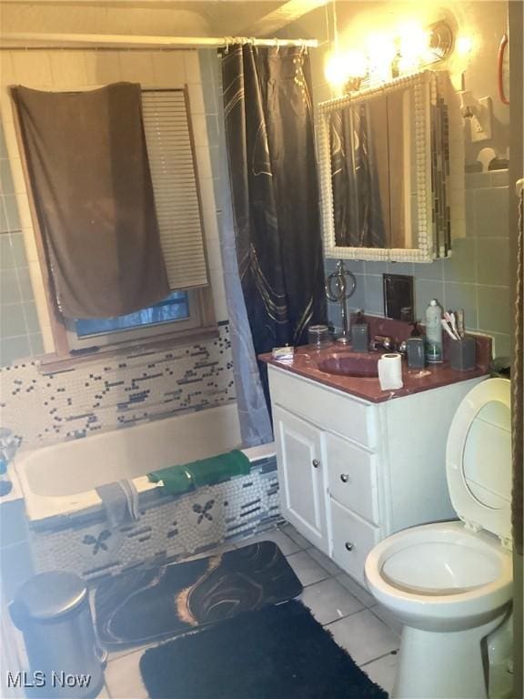 full bathroom featuring toilet, shower / tub combo, tile patterned floors, and tasteful backsplash