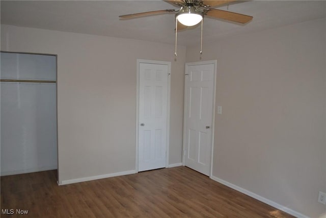 unfurnished bedroom featuring ceiling fan and hardwood / wood-style floors