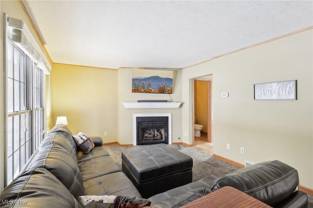 carpeted living room with ornamental molding