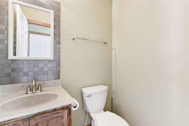 bathroom featuring toilet and vanity