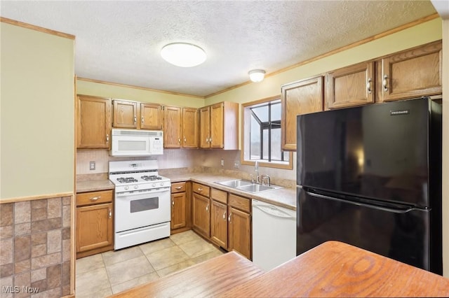 kitchen featuring white appliances, a textured ceiling, sink, light tile patterned flooring, and crown molding