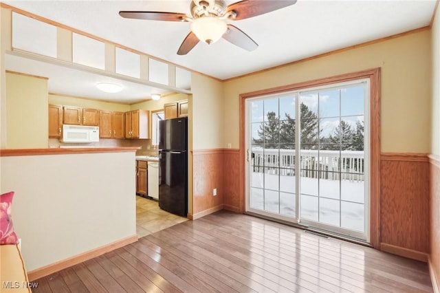 kitchen with light wood-type flooring, ceiling fan, ornamental molding, and white appliances