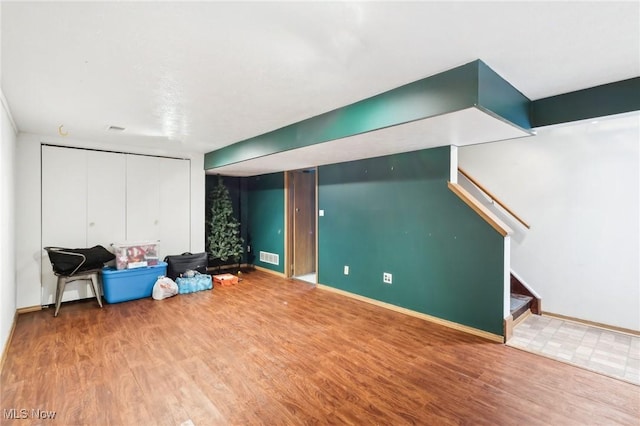 basement featuring wood-type flooring