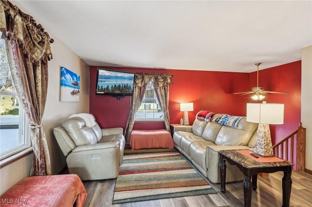 living room with ceiling fan and hardwood / wood-style floors