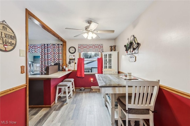 dining room featuring ceiling fan and hardwood / wood-style floors