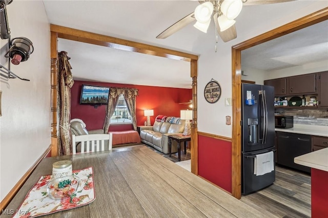 interior space with ceiling fan and dark wood-type flooring