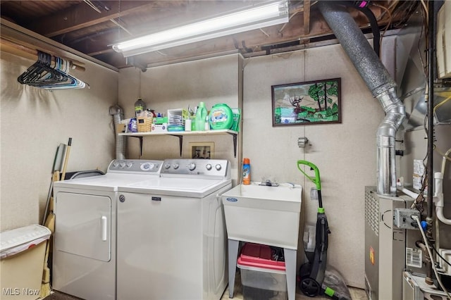 washroom featuring independent washer and dryer and sink