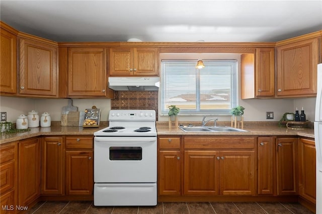 kitchen with white range with electric cooktop and sink