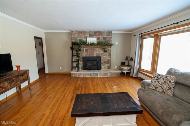 living room featuring ornamental molding and hardwood / wood-style flooring