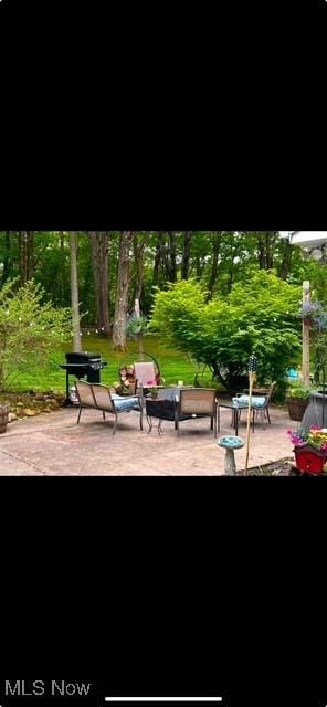 view of home's community featuring a patio area