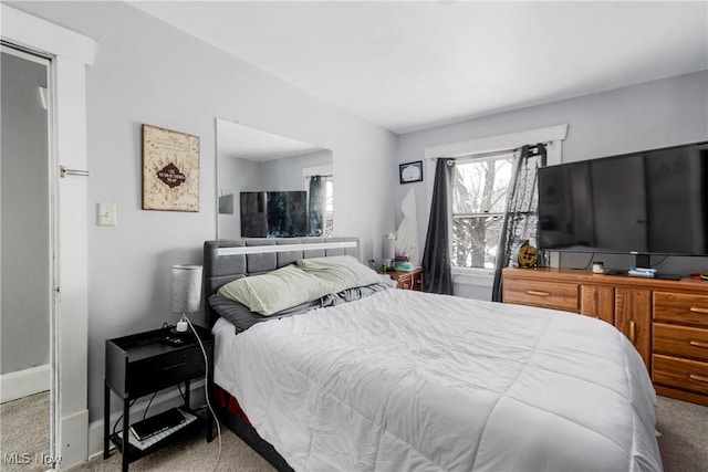 bedroom with light colored carpet