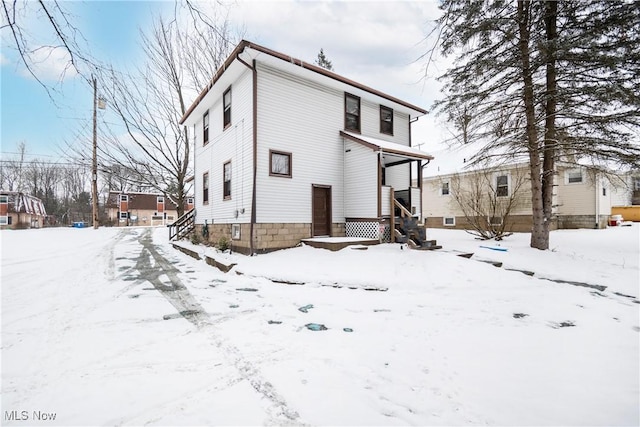 view of snow covered property