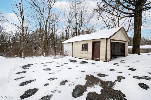 view of snow covered garage