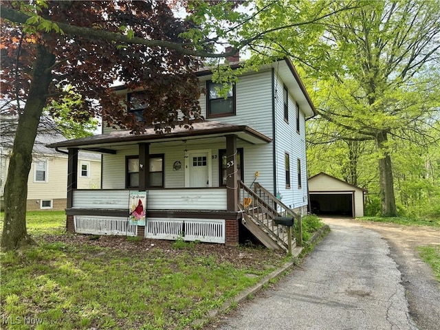 53 Shields Rd, Youngstown, OH 44512 - american foursquare style home with covered porch, an outdoor structure, a detached garage, and a chimney