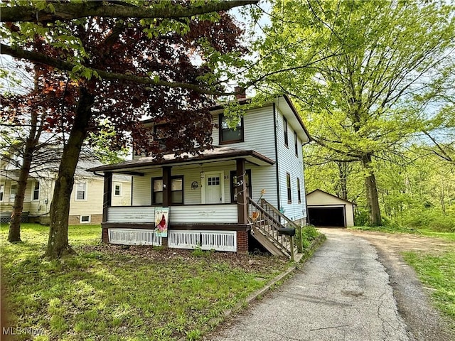 53 Shields Rd, Youngstown, OH 44512 - traditional style home featuring a porch, an outbuilding, a garage, and a chimney